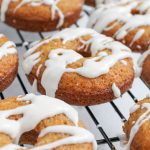 glazed carrot cake donuts on cooling rack