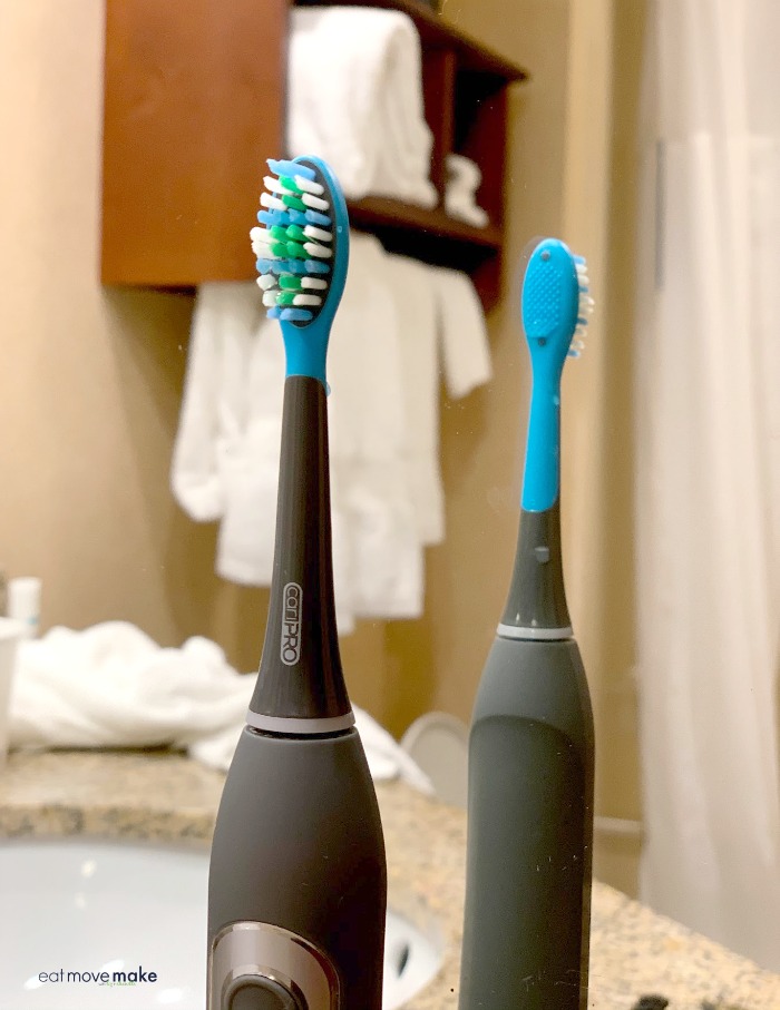 CariPRO electric toothbrush on bathroom counter