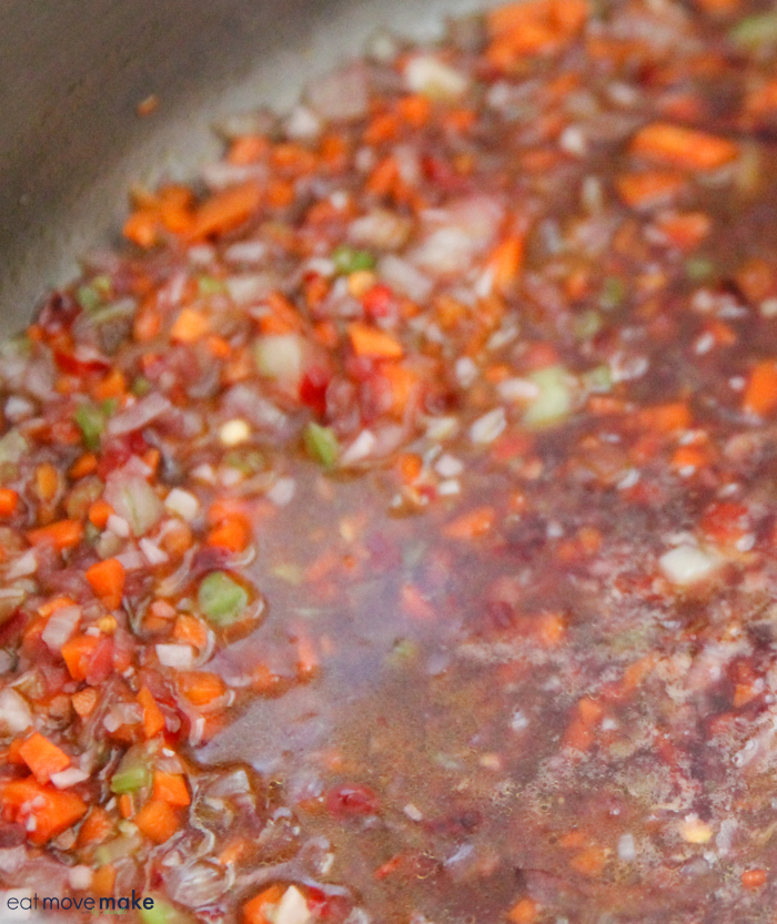 carrots, celery, onions, garlic, wine and chiles in saucepan