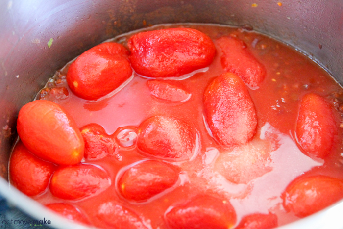 whole plum tomatoes in saucepan