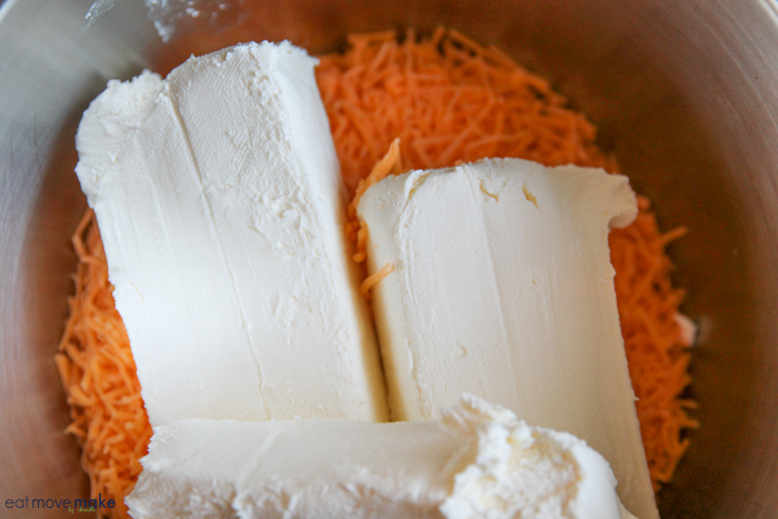 cream cheese and sharp cheddar cheese in mixing bowl