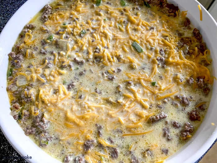 Bisquick egg mixture poured into casserole dish