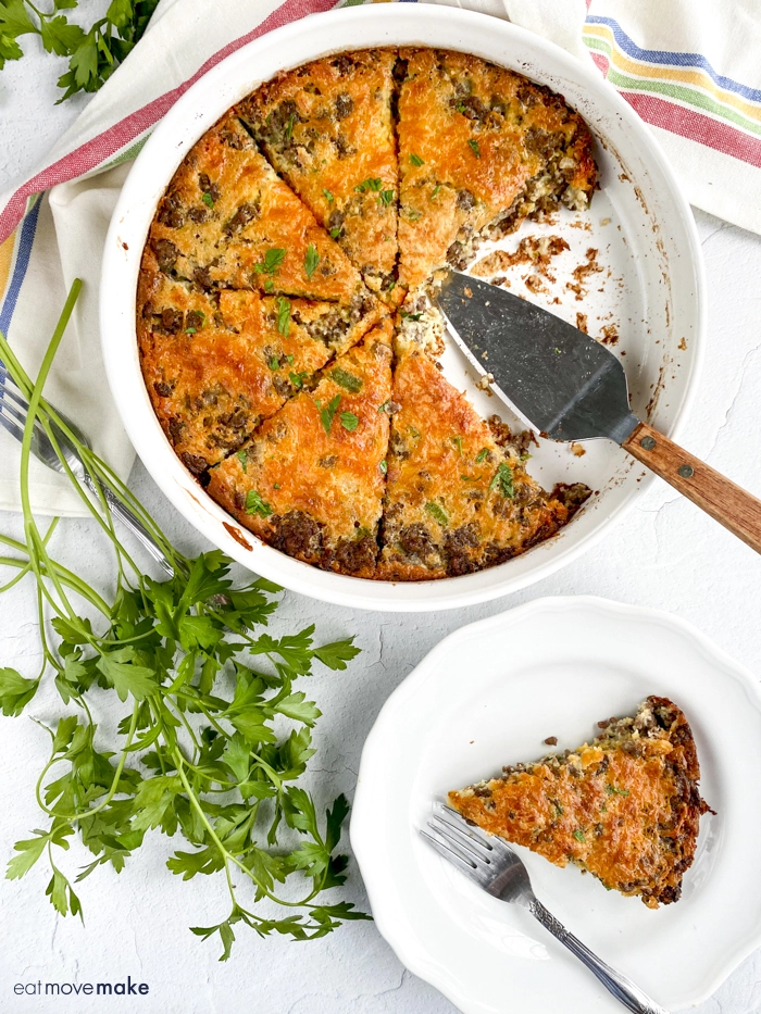 slice of cheeseburger pie on plate next to whole pie