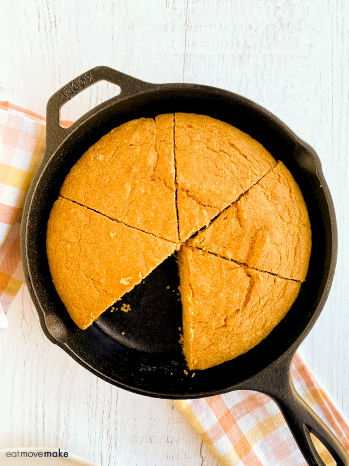 pumpkin cornbread on table with one slice missing