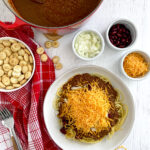 cincinnati chili 5 way on table with extra toppings