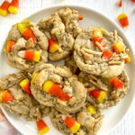white plate with candy corn cookies