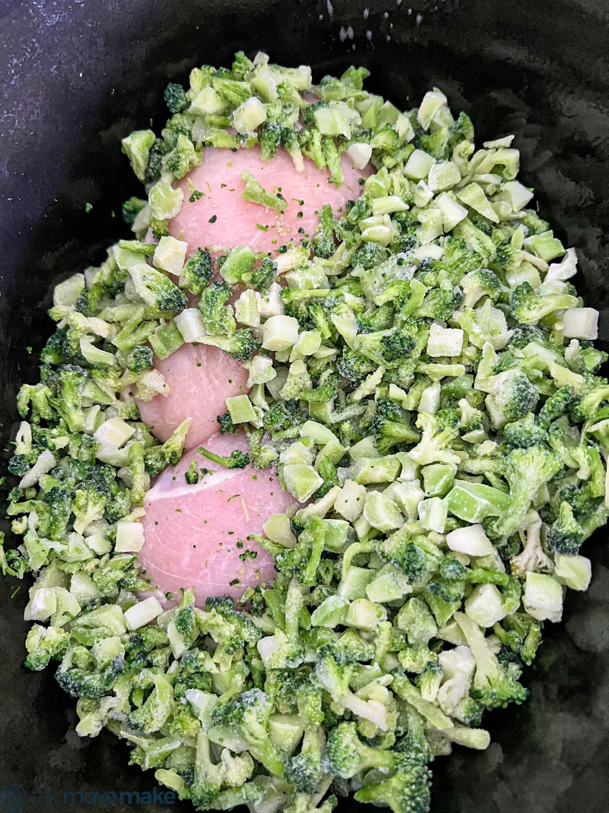 chopped broccoli on top of chicken breasts