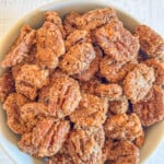 candied pecans in bowl on table.
