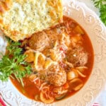 bowl of minestrone soup with meatballs.
