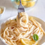 fork twirling pasta on plate.